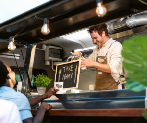 A barista pours coffee for a customer